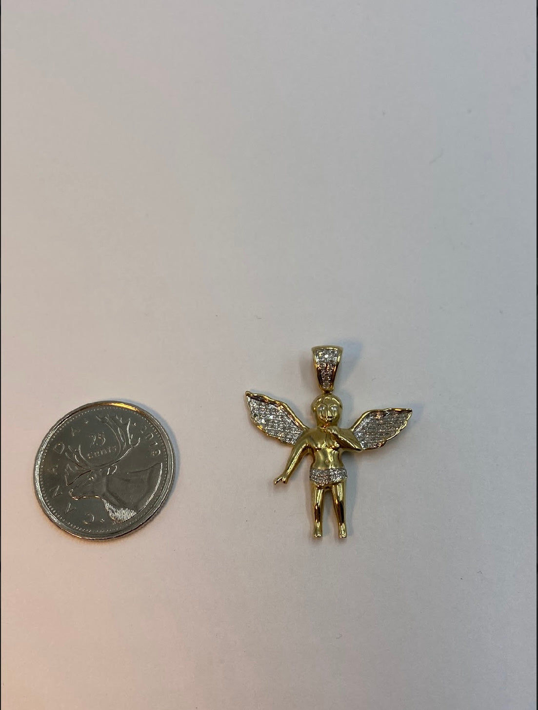 10 karat gold and diamond angel pendant