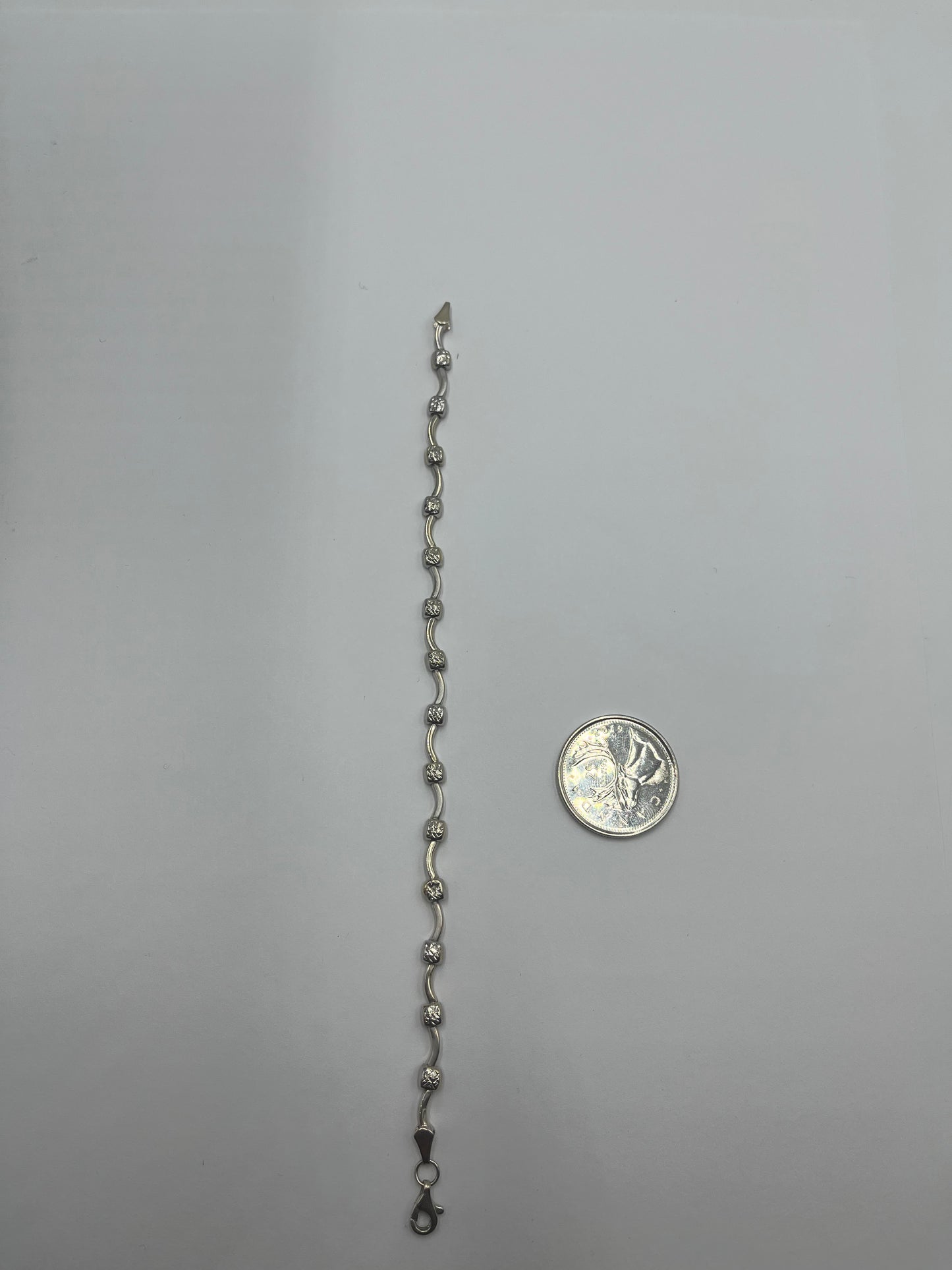 10 karat white gold swirl bracelet