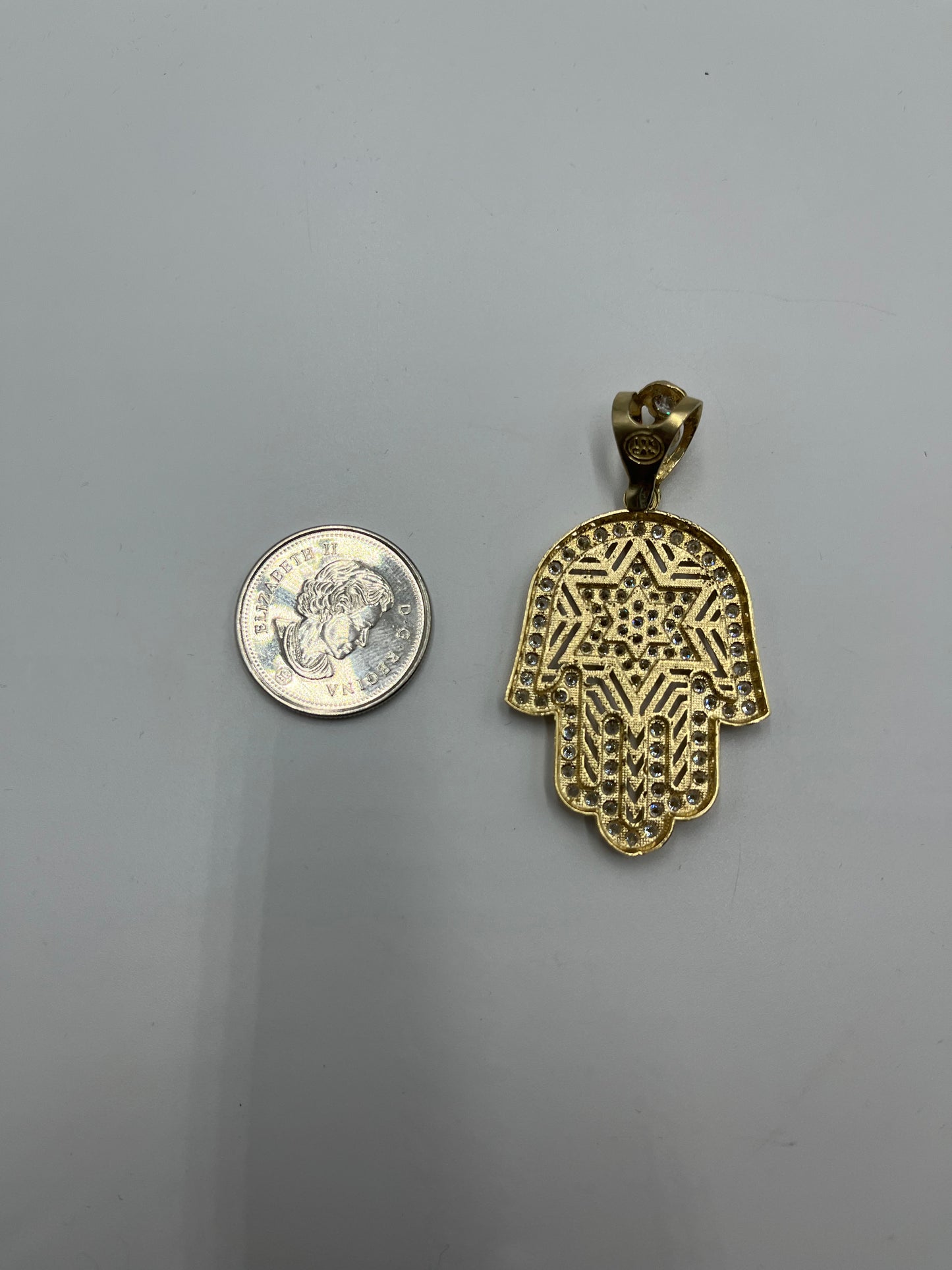 Hamsa 10 karat gold and cz pendant